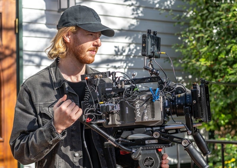 Conner White operating camera on set